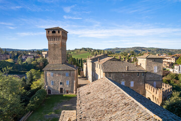 Obraz premium Frontal view of Tower of Levizzano Rangone medieval castle with blue sky background in Emilia Romagna region in Italy