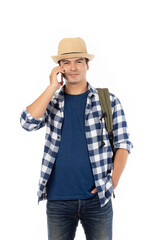 Portrait of cheerful young traveler man with backpack isolated on white background. Tourist man looking happy holding mobile phone.
