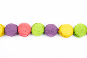 Multicolored macaroons. On a white table background. Cookie dessert