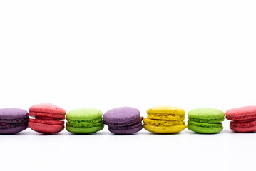 Multicolored macaroons. On a white table background. Cookie dessert