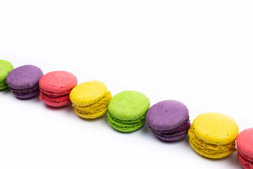 Multicolored macaroons. On a white table background. Cookie dessert