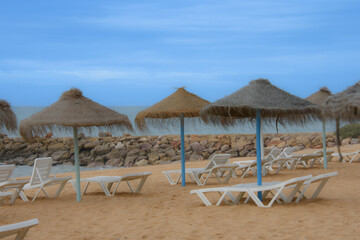 Beautiful sandy beach in Quarteira, Algarve, southern Portugal at the end of the day