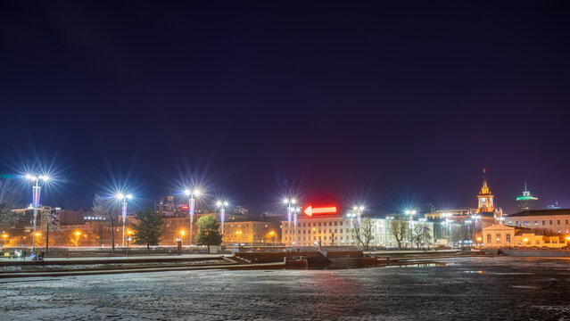 Embankment of the central pond and Plotinka in Yekaterinburg at Early Spring night. The historic center of the city of Yekaterinburg, Russia,