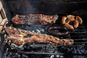 Barbecue, grilled sausages and cow meat , traditional argentine cuisine