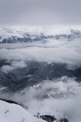 Fototapeta na wymiar Ski Resort Rosa Khutor in winter in the Caucasus mountains with snow. Sochi. Winter. Russia.