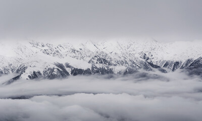 Winter in the Caucasus mountains with snow in the clouds. Sochi. Winter. Russia.