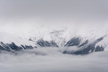 Obraz premium Winter in the Caucasus mountains with snow in the clouds. Sochi. Winter. Russia.