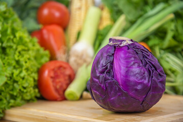 Red cabbage vegetable on top of chopping board