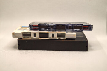 White and gray audio cassettes on a box