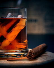cognac in a glass with a cigar