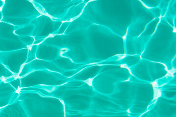 Turquoise blue surface of a swimming pool.