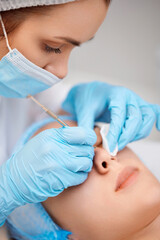 Naklejka premium woman during a mechanical face cleansing procedure