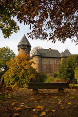 castle in autrumn mood with bench