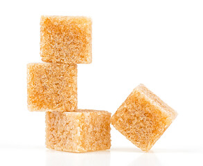 Brown cane sugar cubes isolated on a white background