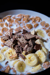 Cereal dessert with milk and banana with chocolate