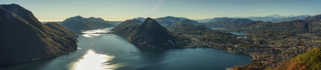 Panoramic photography of Lake Lugano seen from Monte Brè. - obrazy, fototapety, plakaty