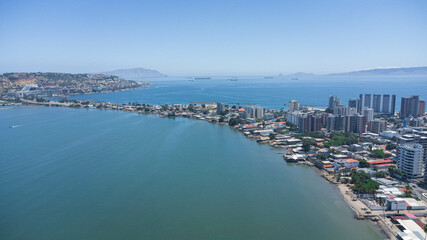 Naklejka na ściany i meble Drone photos (overhead view) of Cerro el Morro, Lido beach, Los Canales beach and the city of Lechería. In the photos you can see boats navigating the coasts of Cerro El Morro from an overhead shot, a