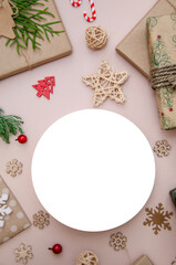 Christmas composition. Vertical flat lay composition with Christmas decorations and white round ad space. Round mock up.