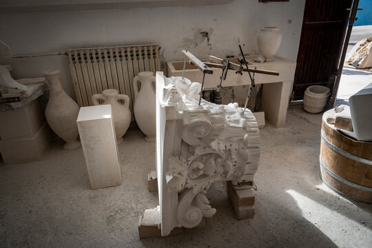 Greek column capitel made from white island stone in famous school of masonry in Pucisca on Brac island, Croatia
