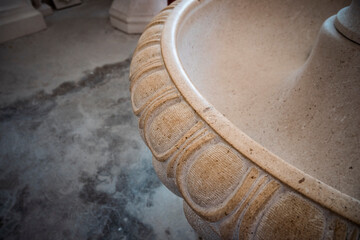 Close up of hand made fountain bowl in stonemason school in the town of Pucisca, located on Brac island, Croatia