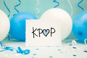 Kpop with heart - korean pop music concept, card with text on blue and white background with air balloons
