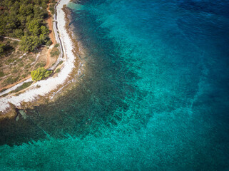 Aerial image of beautiful rocky coast of Brac island, with wonderful, turquoise sea below