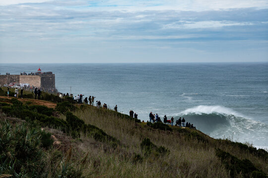 People watching big waves