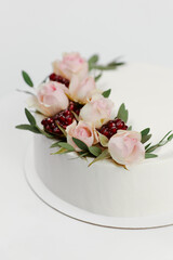 white wedding cake decorated with flowers