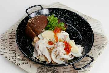 rye burger with salad and caviar