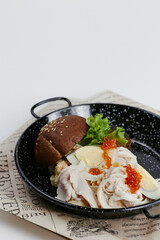 rye burger with salad and caviar