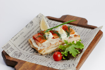 pancakes with vegetables and red fish