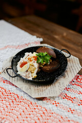 rye burger with salad and caviar