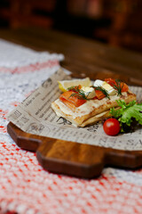 pancakes with vegetables and red fish