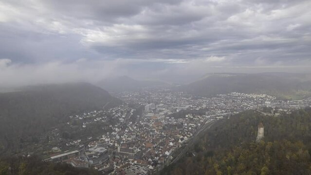 Tower &Ouml;denturm, castle Helfenstein and city Geislingen on cloudy and sunny morning time lapse