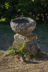 Ancient stone baptism font in Lira, Galici