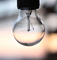 Light Bulb at outside sunset background