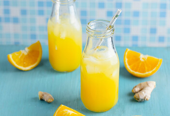 Fototapeta na wymiar Tropical fruity drink with pineapple and orange