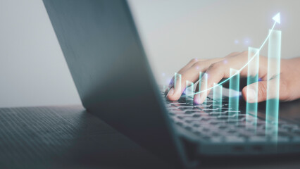 ฺBusiness growth and financial investment concept. Businessmen use laptop to analysis data economic diagram trend show graphs and arrow profit growth, Business planning and strategy success.