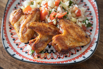 Grilled chicken wings with bulgur salad
