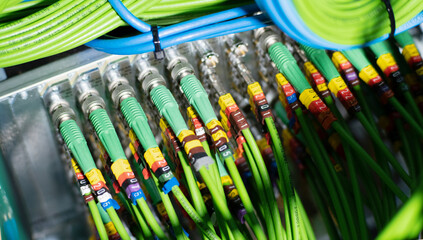 A large number of SDI wires and connectors. Bnc patch panel cabling. High quality photo