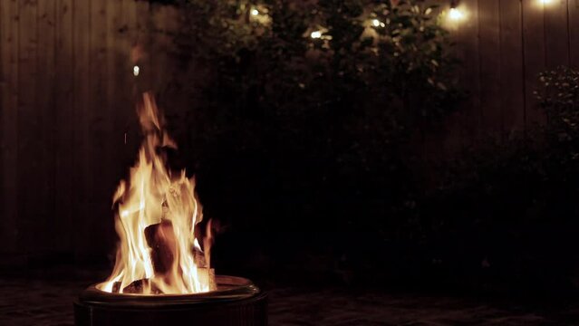 wide shot of a fire in a backyard firepit