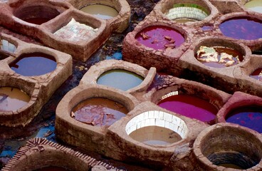 Fez, Morocco - Traditional leather tanning vats. Intentional grain in structures for gritty look.