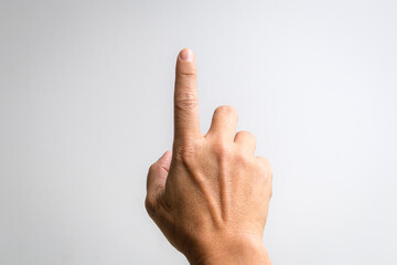 Male hand with index finger pointing up. White background.