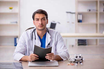 Young male doctor working in the clinic