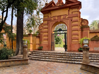 View of the orange arched gate and steps. 