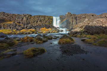 Beautiful waterfall with turquoise water in Iceland