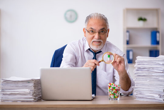 Old Male Employee Feeling Bad In The Office