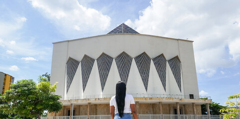 Woman standing in front of the cathedral in Barranquilla, Colombia