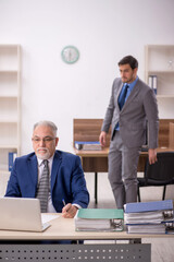 Two male colleagues working in the office