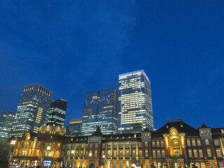 Fototapeta na wymiar Illuminations shine Japan Night view of Marunouchi Tokyo Station Business Building Winter landscape background